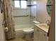 Well-lit bathroom features a shower-tub combo and sleek vanity at 1002 Pussywillow Ln, Bradenton, FL 34208