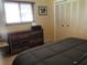 This cozy bedroom features a closet, dresser, and natural light from the window at 1002 Pussywillow Ln, Bradenton, FL 34208