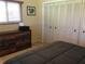This cozy bedroom features a closet, dresser, and natural light from the window at 1002 Pussywillow Ln, Bradenton, FL 34208