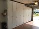 Spacious garage with ample built-in storage cabinets, providing an organized space for vehicles and belongings at 1002 Pussywillow Ln, Bradenton, FL 34208