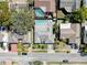 An aerial view of the property that highlights its backyard pool and screen enclosed patio at 1102 Springtime Dr, Holiday, FL 34691