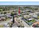 An aerial view of the property, showcasing its location near a lake and surrounding neighborhood at 1102 Springtime Dr, Holiday, FL 34691