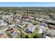 An aerial view of the home, displaying its location near a lake and the surrounding community at 1102 Springtime Dr, Holiday, FL 34691