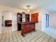 A well-lit bar area with a sliding door provides easy access to the outdoor space at 1102 Springtime Dr, Holiday, FL 34691
