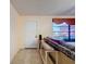 Entryway with a white door, tile flooring, and a console table with window at 1102 Springtime Dr, Holiday, FL 34691