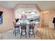 Kitchen area with tile floors, white countertops and a breakfast bar at 1102 Springtime Dr, Holiday, FL 34691