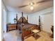 Main bedroom with unique furniture and a ceiling fan at 1102 Springtime Dr, Holiday, FL 34691
