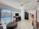 Functional office with pool views, ample desk space, a ceiling fan and adjacent closet space at 1102 Springtime Dr, Holiday, FL 34691