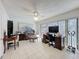 Bright office space with pool views, tile flooring, a ceiling fan and space for exercise equipment at 1102 Springtime Dr, Holiday, FL 34691