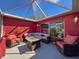 Outdoor patio area with comfortable seating, creating a relaxing space for enjoying the weather at 1102 Springtime Dr, Holiday, FL 34691