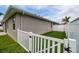 Green backyard features white privacy fence and gated entrance at 11335 77Th E St, Parrish, FL 34219