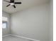 Neutral bedroom with ceiling fan and natural light from window at 11335 77Th E St, Parrish, FL 34219