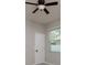 Neutral bedroom with ceiling fan and window at 11335 77Th E St, Parrish, FL 34219