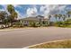 Elegant clubhouse featuring lush landscaping, covered entryway, and plenty of parking at 11335 77Th E St, Parrish, FL 34219