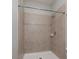 Tiled shower stall features neutral color tile and modern shower fixtures at 11335 77Th E St, Parrish, FL 34219