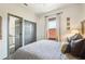 Stylish bedroom with en-suite bathroom and closet and comfortable plaid duvet cover at 114 E Emily St, Tampa, FL 33603