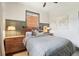 Comfortable bedroom featuring a plaid duvet cover, natural light, and warm decor at 114 E Emily St, Tampa, FL 33603