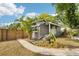 Charming home exterior with a walkway, lush landscaping, and a welcoming front porch at 114 E Emily St, Tampa, FL 33603