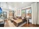 Bright and spacious living room with hardwood floors, comfortable seating, and large windows at 114 E Emily St, Tampa, FL 33603