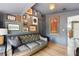 Cozy living room featuring stylish decor, hardwood floors, and a comfortable leather couch at 114 E Emily St, Tampa, FL 33603