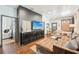 Open-concept living room boasting hardwood floors, ample seating, and a contemporary entertainment center at 114 E Emily St, Tampa, FL 33603