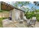 Inviting outdoor bar area with metal siding, wooden accents and patio seating at 114 E Emily St, Tampa, FL 33603