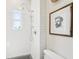 Modern bathroom with subway tile, a rainfall shower head, and natural light from the window at 114 E Emily St, Tampa, FL 33603