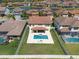 Overhead view of a house with a pool and backyard, nestled in a residential community at 11966 Climbing Fern Ave, Riverview, FL 33579