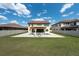 Inviting backyard pool with stone surround and ample seating area for relaxing and entertaining at 11966 Climbing Fern Ave, Riverview, FL 33579