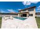Spacious backyard with a pool, spa, outdoor seating, and covered patio perfect for outdoor entertaining at 11966 Climbing Fern Ave, Riverview, FL 33579