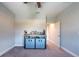 Bedroom featuring plush carpeting and views into the hallway at 11966 Climbing Fern Ave, Riverview, FL 33579