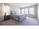 Bright bedroom with neutral color scheme, plush carpet, and abundant natural light at 11966 Climbing Fern Ave, Riverview, FL 33579