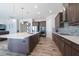 This kitchen has a large center island with a white countertop and stainless steel appliances at 11966 Climbing Fern Ave, Riverview, FL 33579