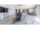 Open concept living room with a comfortable seating area, modern kitchen and eat in dining space at 11966 Climbing Fern Ave, Riverview, FL 33579