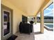 Covered outdoor patio with convenient access to the pool and grill area, great for entertaining at 11966 Climbing Fern Ave, Riverview, FL 33579