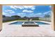 Inviting swimming pool with a built-in spa and outdoor seating, perfect for relaxation at 11966 Climbing Fern Ave, Riverview, FL 33579