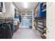 Spacious walk-in closet with custom shelving and ample storage space at 11966 Climbing Fern Ave, Riverview, FL 33579