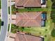 Aerial view showcases home with large backyard and screened pool at 12379 Amica Loop, Venice, FL 34293