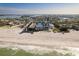 Aerial view showcases beachfront homes, with amazing coastline views of the ocean at 12512 1St W St # 2, Treasure Island, FL 33706
