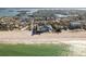 Aerial shot of beachfront homes along the water, blending residential living with natural beauty at 12512 1St W St # 2, Treasure Island, FL 33706