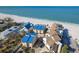 Stunning aerial view of beachfront homes, offering unparalleled access to the ocean and beach at 12512 1St W St # 2, Treasure Island, FL 33706