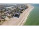 Breathtaking aerial view showcasing a coastal community with beachfront homes and a beautiful shoreline at 12512 1St W St # 2, Treasure Island, FL 33706
