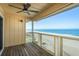Relax on this oceanfront balcony with a ceiling fan and panoramic views of the beach and ocean at 12512 1St W St # 2, Treasure Island, FL 33706