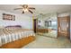 Spacious bedroom featuring a mirrored wall that reflects ocean views, enhancing the room's open and airy feel at 12512 1St W St # 2, Treasure Island, FL 33706