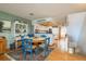 Bright dining area adjacent to an open kitchen with hardwood floors at 12512 1St W St # 2, Treasure Island, FL 33706