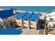 Beachfront home with a modern blue roof and inviting exterior, steps from the sand at 12512 1St W St # 2, Treasure Island, FL 33706