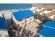 Coastal home with a vibrant blue roof offers beachfront living with convenient garage parking at 12512 1St W St # 2, Treasure Island, FL 33706