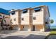Three-story condo building featuring private garages and direct beach access at 12512 1St W St # 2, Treasure Island, FL 33706