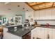 Open kitchen with granite countertops, seamlessly connected to the dining area at 12512 1St W St # 2, Treasure Island, FL 33706