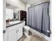 Bathroom featuring a single sink, granite countertops, modern hardware, and a shower-tub combo at 12841 Wildflower Meadow Dr, Riverview, FL 33579
